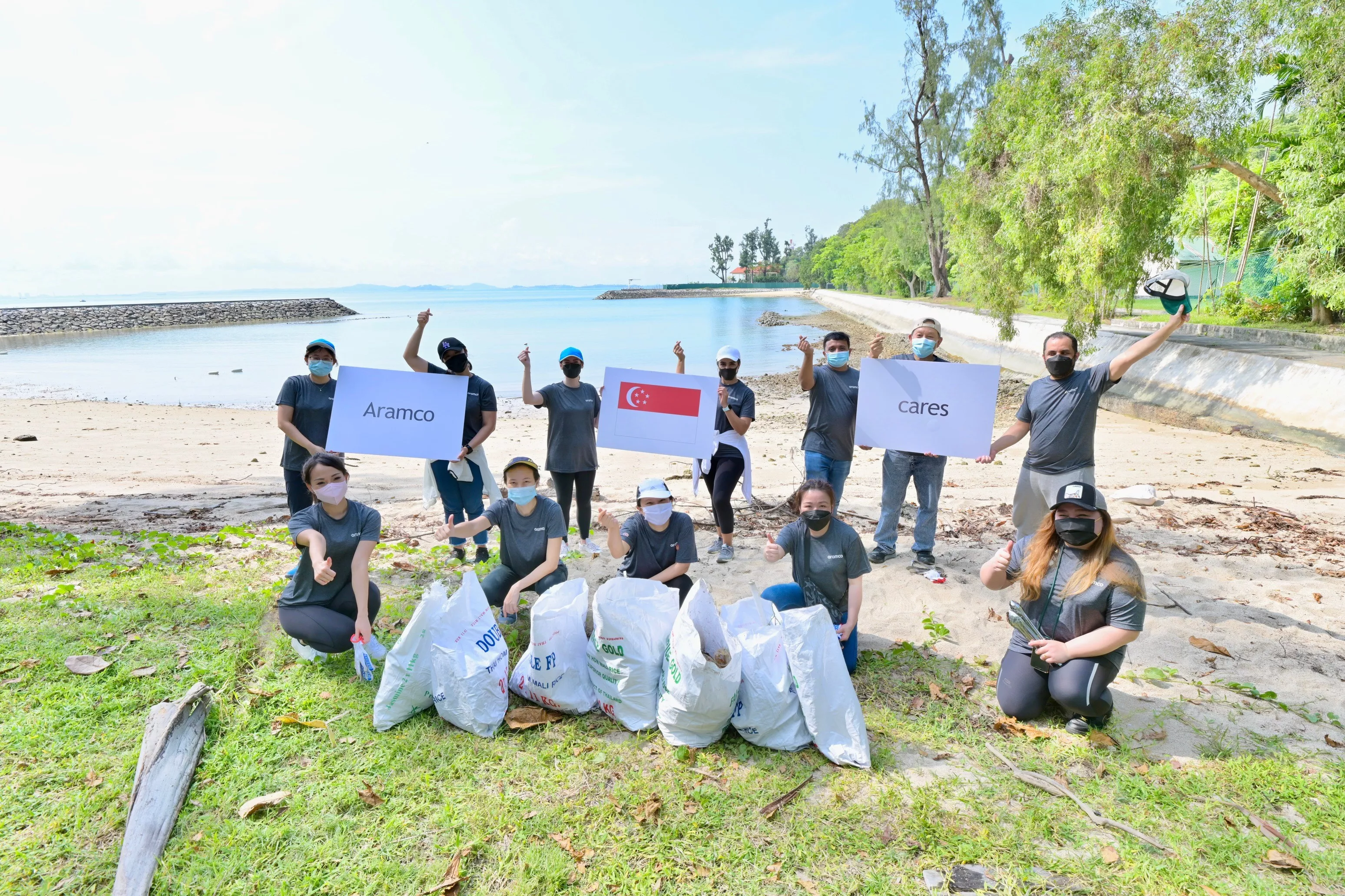 Aramco Singapore group photo during coastal cleanup on 26 Mar